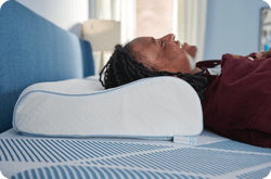 Man laying on Dreamlife pillow