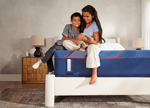 Children sitting on an Elite mattress - mobile